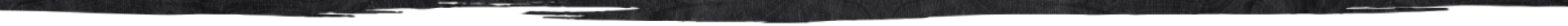 Torn black paper with uneven edges against a white background.
